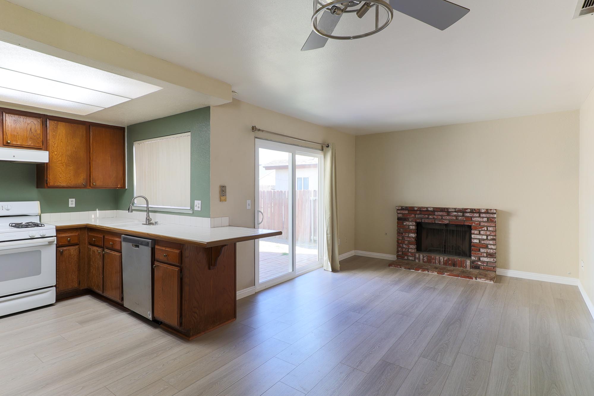 Chardoney family room with fireplace and kitchen photo