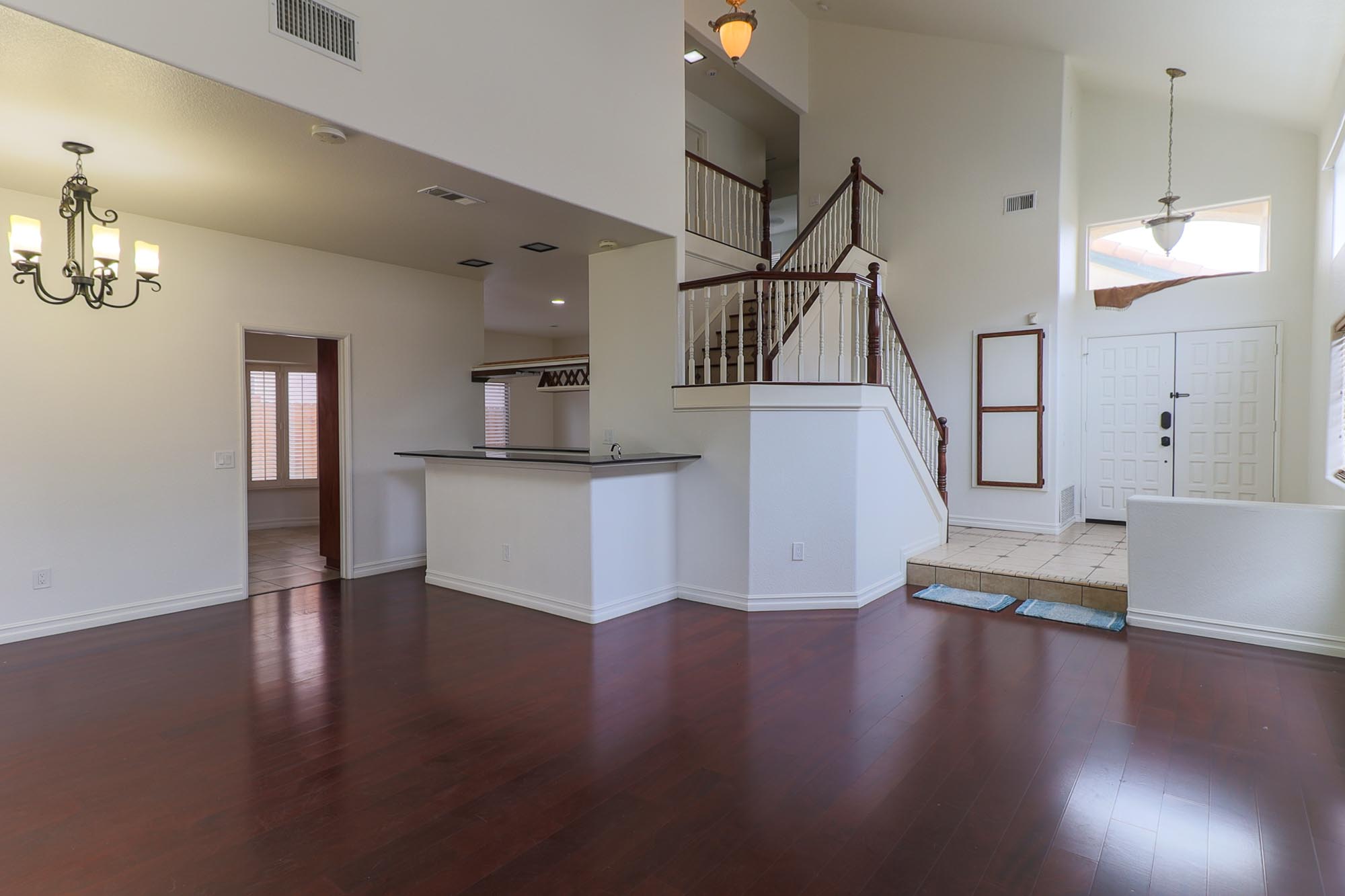 War Cloud family room showing bar, stairs, and entry photo