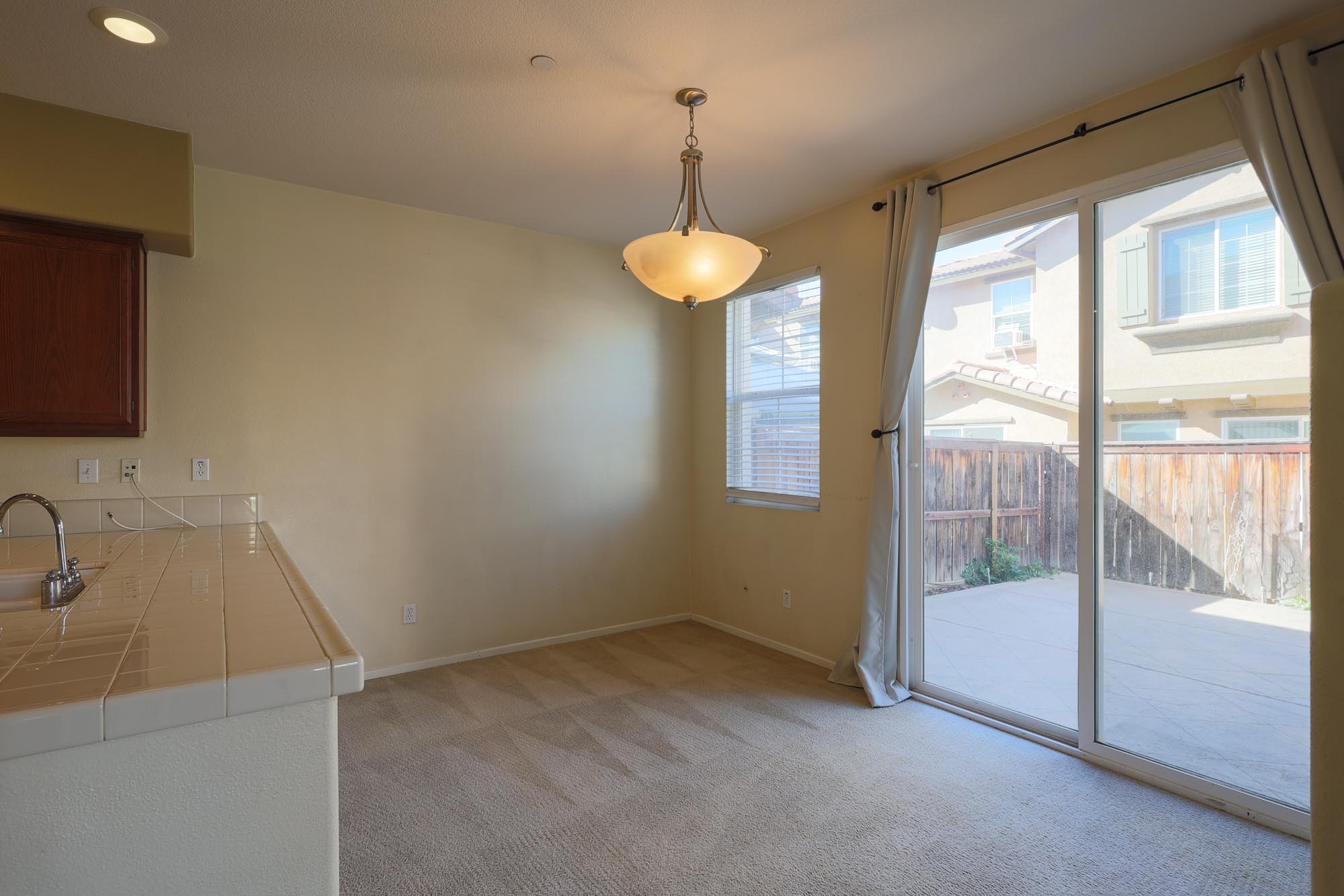 Wind Chime dining area with access to the backyard photo