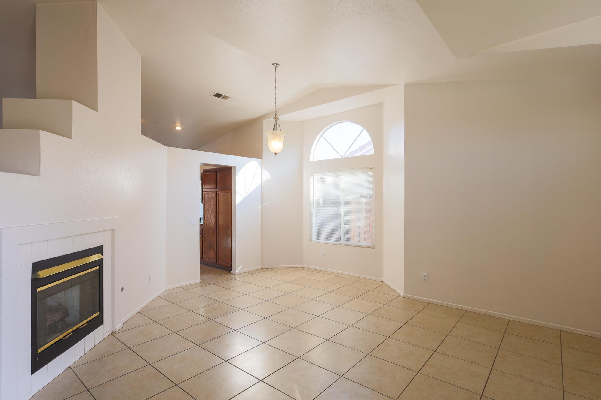 Superior living room and dining room photo with fireplace